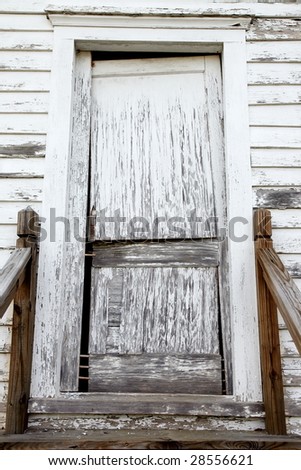 Old, weathered and broken door