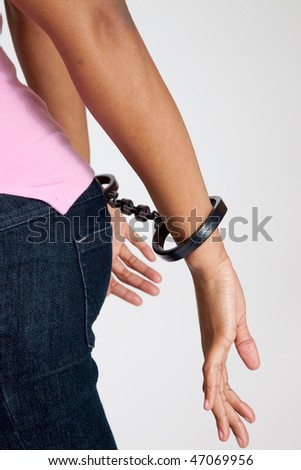 stock photo African american woman handcuffed