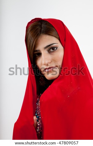Woman in red with her head covered
