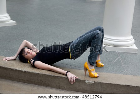 Woman on steps arching her pelvis