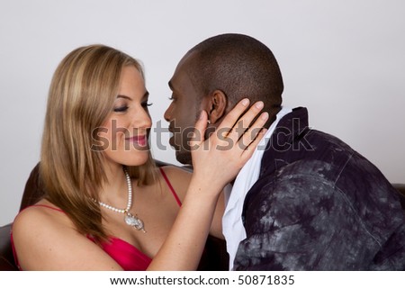 African American man seducing a caucasian blond woman