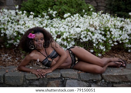Lovely black woman with flower in her hair