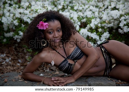 Lovely black woman with flower in her hair