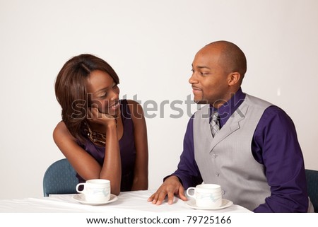 Black couple sharing a romantic, cup of coffee together