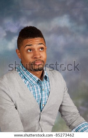 Handsome black man with eye contact, and a thoughtful expression