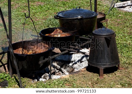 Food Cooked Over An Open Fire In Cast Iron P