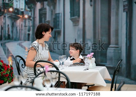 Mother and son having lunch together