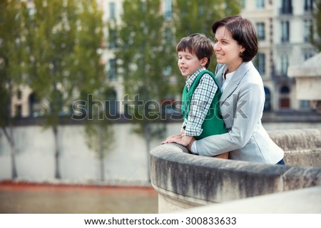 Mother and son having fun during summer vacation, Paris, France