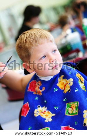 Four year old boy getting haircut at