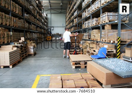 Busy warehouse with people working