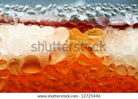 Water drops on the surface of glass with icy cold drink