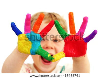 stock photo : Five year old boy with hands painted in colorful paints ready for hand prints