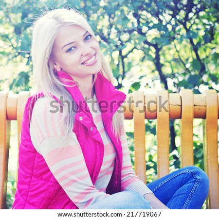 young smiling woman looking into camera