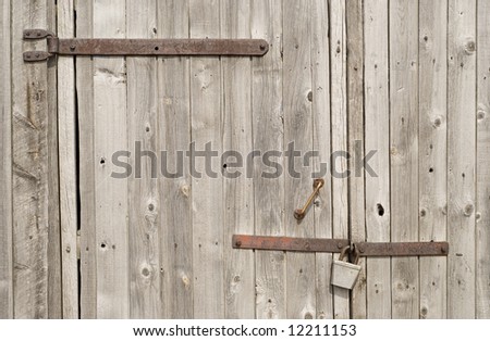 close-up view of wooden gate and lock