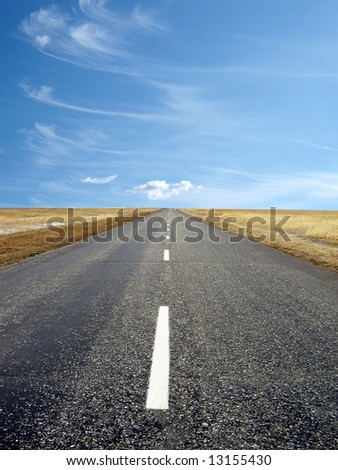 country highway with a beautiful blue sky