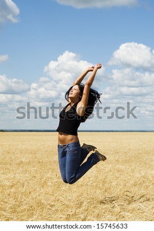 beautiful jumping woman over nature background