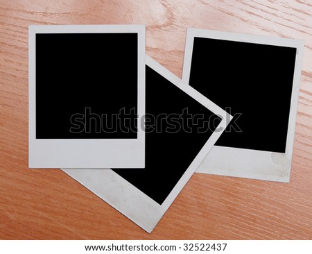 photo frames on wooden background