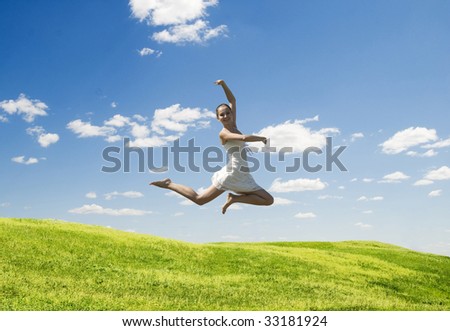 happy jumping woman against nature background