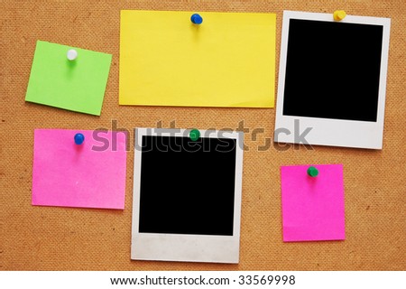 empty photo frame and empty notes on wooden background