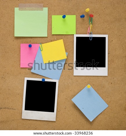 empty photo frames and notes on wooden background