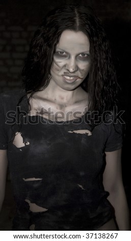 portrait of young scary woman in dark