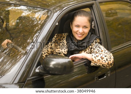 young attractive businesswoman driving her car