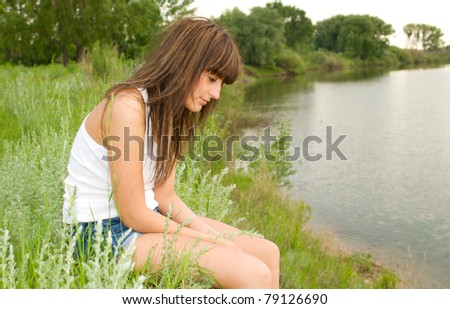 sad woman at the bank of river