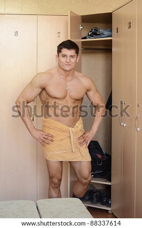 muscular perfect male in locker room