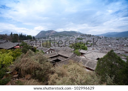 Ancient roof in Lijiang old town with Snow mountain background , Yunnan China