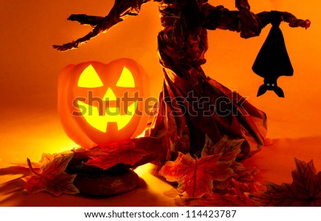 Halloween pumpkin under spooky tree