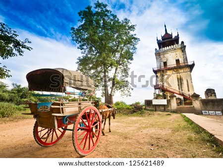 Horse Drawn Carriage parking in front of Nanmyin watchtower  in Inwa ancient city, Mandalay Myanmar