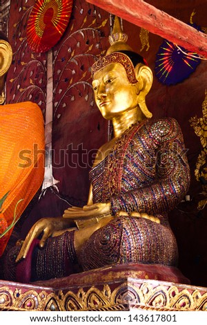 KENGTONG MYANMAR-JU LY 29 Beautiful Buddha statue decorate by jewelry and color glass at wat yang gon temple on July 29 2007 in Kengtong Kyaing tong city Shan state Myanmar KENGTONG MYANMAR-JU LY 29 Beautiful Buddha statue decorate by jewelry and color glass at wat yang gon temple on July 29 2007 in Kengtong Kyaing tong city Shan state Myanmar
