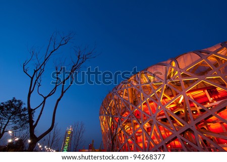 BEIJING - APRIL 13 : Beijing National Stadium or the Bird\'s Nest stadium at Dusk on April 13, 2010 in Beijing, China. Was a landmark of modern China located on Beijing Olympic Green.