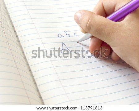 little hand writing homework on exercise book