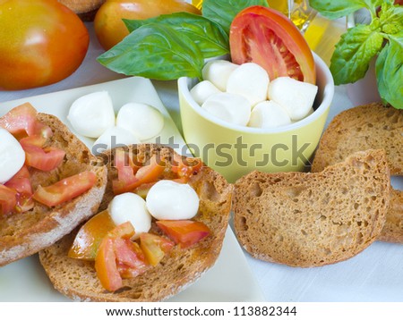 neapolitan food dried bread with olive oil and tomato and mozzarella