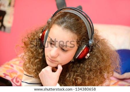 girl listening to music on the computer