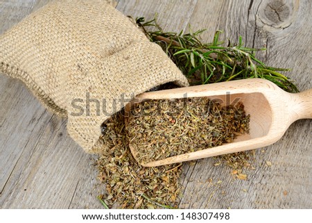herbs and fragrant on wooden table in a jute bag