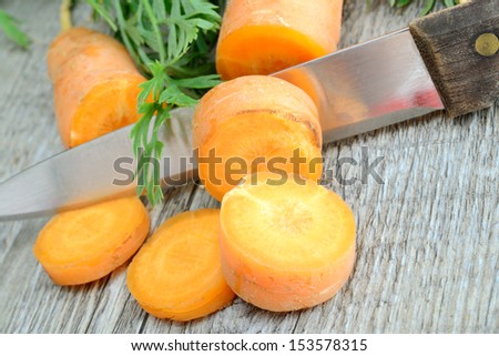 fresh and colorful natural carrots on wooden table
