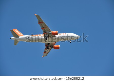MILAN, ITALY- AUGUST 12: EasyJet is the third largest low-cost airline in the world, after the U.S. Southwest Airlines and Ireland\'s Ryanair on August 12, 2013 in Milan-Italy