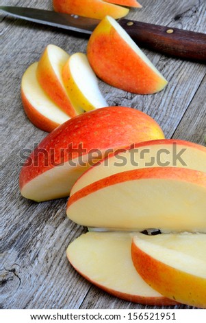 sweet delicious royal gala apple sliced on wooden table