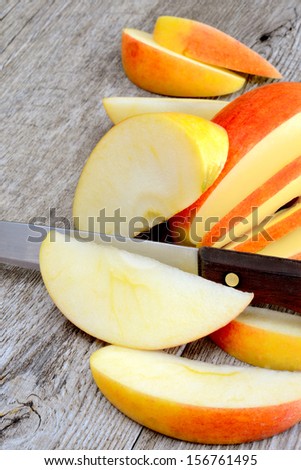 sweet delicious royal gala apple sliced on wooden table