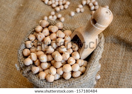 dried white chickpeas ceci on sack close up