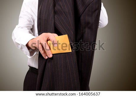 business man hands him an envelope for corruption