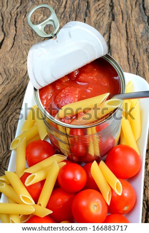 tomatoes in jar of aluminum ready for seasoning pasta
