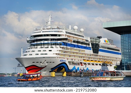 AMSTERDAM, CIRCA AUGUST,2014:Tourists greetings on Cruise ship Aida Stella 253 meters well and all are recognizable because they have red lips drawn in Amsterdam on circa August, 2014