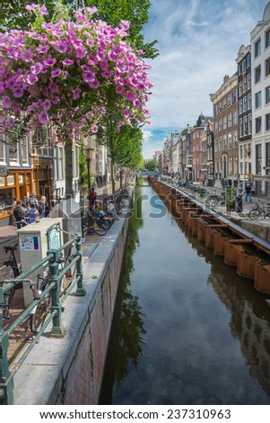 AMSTERDAM - AUGUST 4: Typical landscape with roads and canals of the city center on august 4, 2014 in Amsterdam