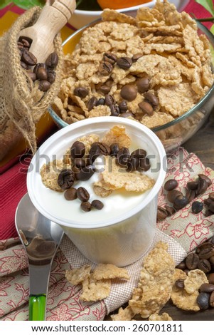 low-fat plain yogurt creamy with crispy cereals and coffee beans