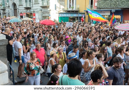 NAPLES, ITALY-JULY 11:crowd of the procession of the event\'s annual Gay Pride in old town. The associations in the front line for the guarantee of the rights of homosexuals on  july 11, 2015 in Naples