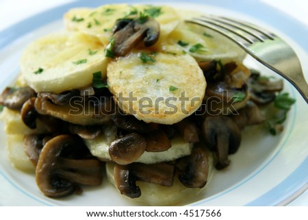 Potatoes with fried mushrooms.