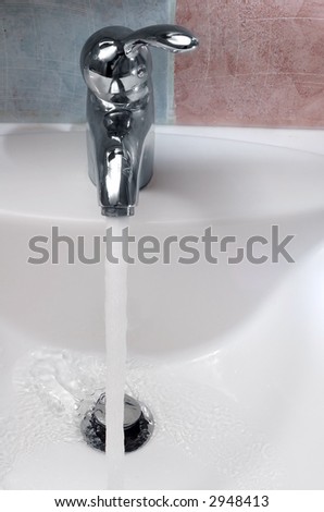 Photo of a chrome metal sink.